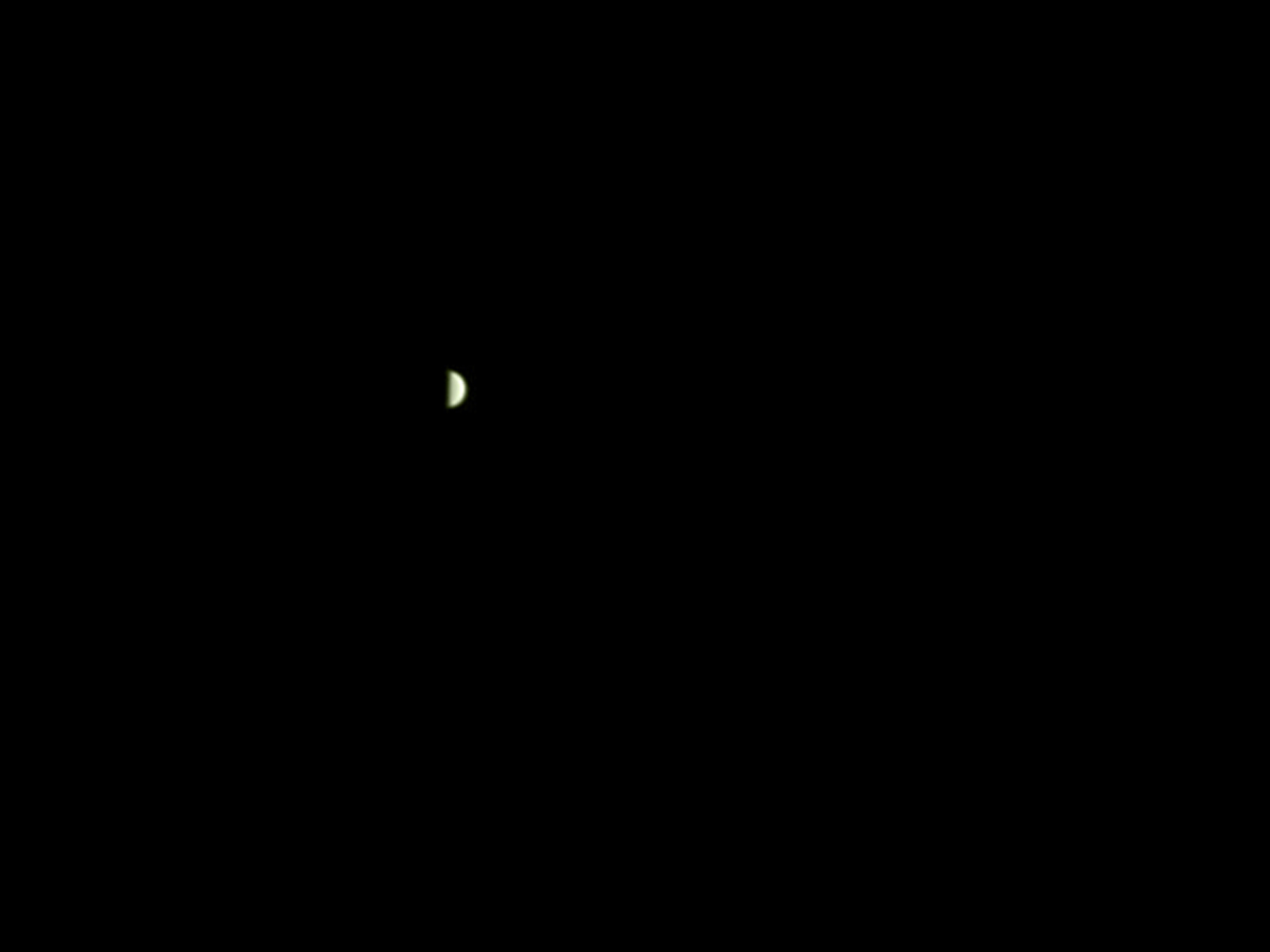 A photograph of the planet Venus in the night sky